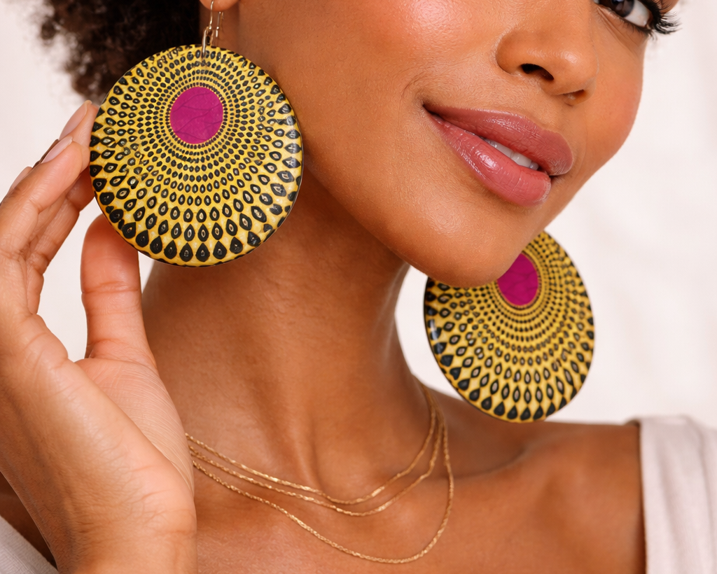 Model wearing Bijoul statement Plexi-wax earrings inspired by African heritage and modern elegance