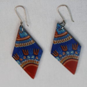 Dashiki-inspired plexiglass earrings in blue and orange geometric pattern.