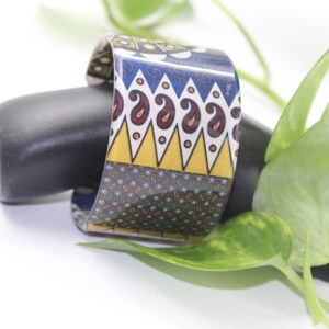 Vale plexi-wax bangle with ankara pattern in gold and black.
